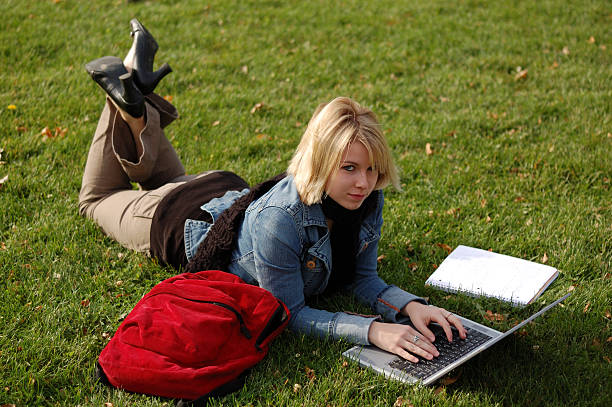 Young woman on laptop computer stock photo