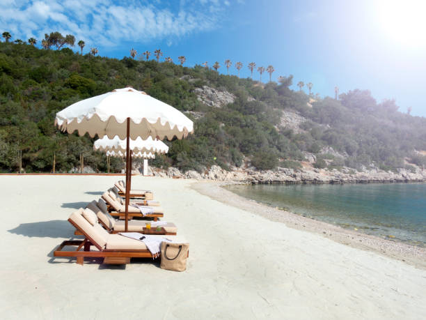 istock Beach chairs with umbrellas and beautiful sand beach 1402542207