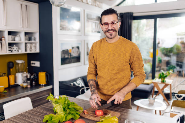 istock Young vegetarian cooking at home 1402545620