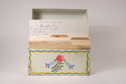 Old tin file box with recipes in it, pumpkin pie recipe showing