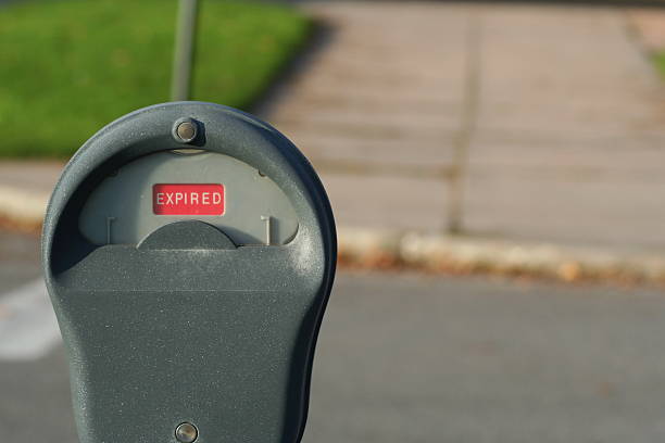 an expired parking meter on a hill