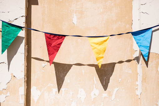 Birthday flags. They hang in the background of an old tenement house Krakow in Poland.