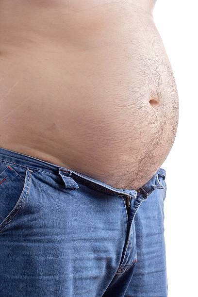 istock Overweight man with his pants half opened 140254999