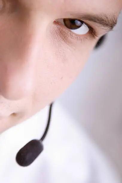close up of young man wearing headset
