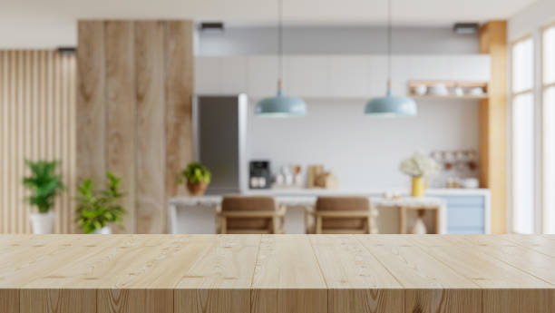 istock Wooden table top on blur kitchen room background,Modern Contemporary kitchen room interior. 1402551681