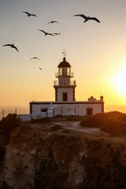 Seashore lighthouse, beacon during sunset