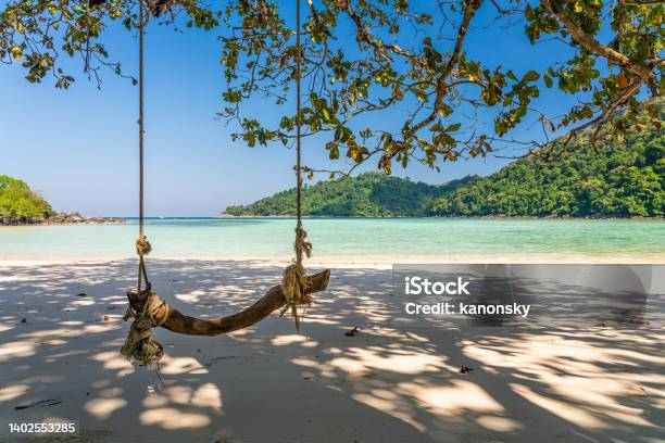 Wooden Swing On Beautiful White Sand Beach Surin Island National Park Phang Nga Thailand Stock Photo - Download Image Now