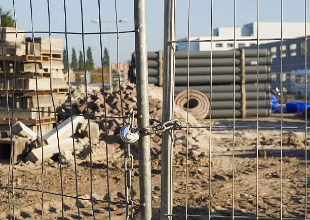 Photo of Locked fence at building site