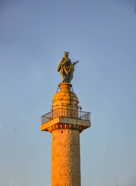 istock Saint Peter statue on the top of the Trajan column 1402554664