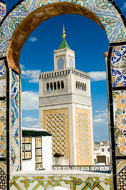 istock Mosque tower - framed with ornamental arch in Tunis 140255473
