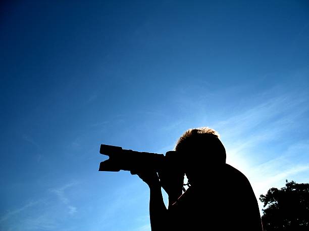 istock Silhouette of photographer at work 140255962