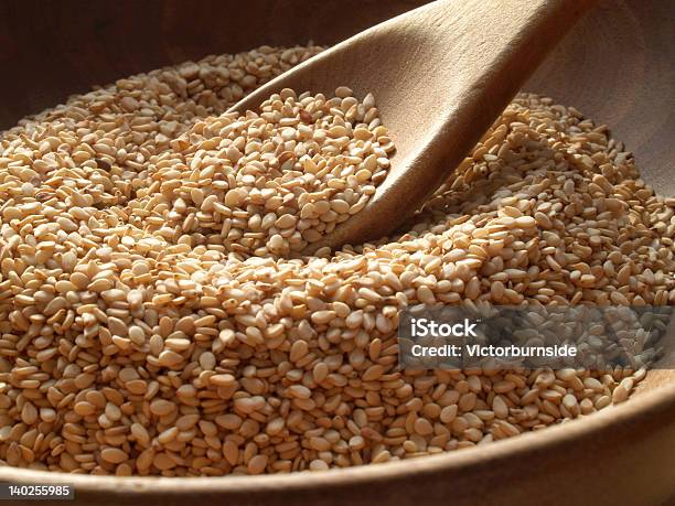 Closeup Of A Wooden Spoon And Bowl Containing Sesame Seeds Stock Photo - Download Image Now