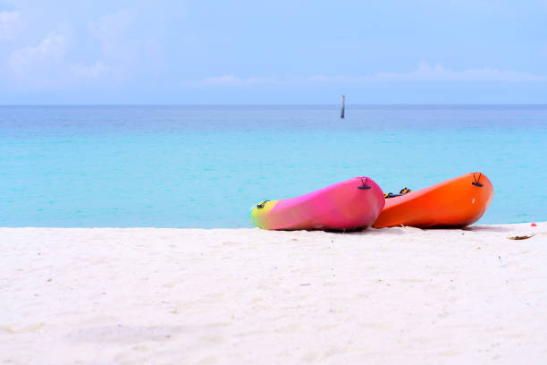 istock sea kayaks or multicolor boat on beautiful beach in Thailand 1402562492