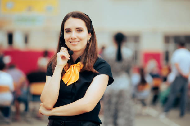 Event Coordinator Wearing Hands Free Microphone Organizing a Public Event
