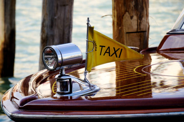 Close-up of venetian boat taxi - taxi boat in Venice, Italy Close-up of venetian boat taxi - taxi boat in Venice, Italy watertaxi stock pictures, royalty-free photos & images