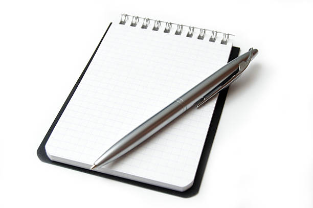 istock Blank page of a notebook with pen on a white background 140258517