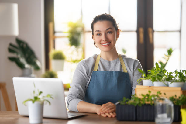 istock Woman caring for plants 1402585436
