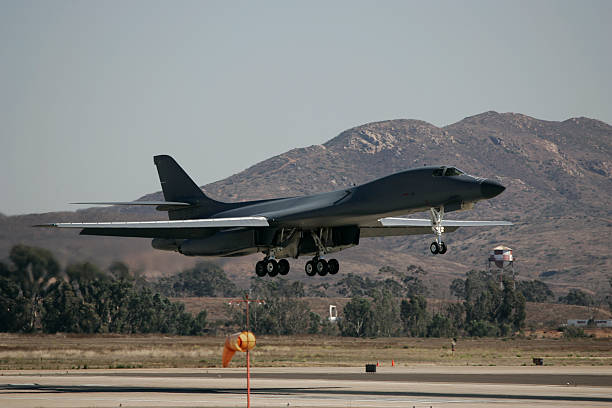 B-1 Bomber Landing B-1 Bomber military aircraft landing. b1 bomber stock pictures, royalty-free photos & images