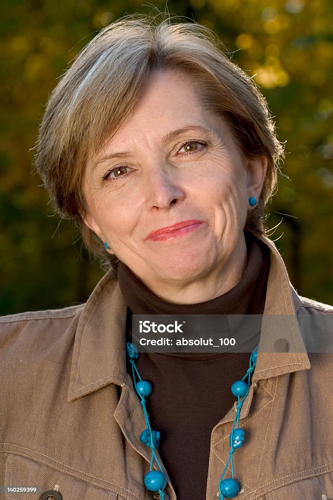 Woman in her fifties Portrait of a woman in her fifties. 50-54 Years Stock Photo