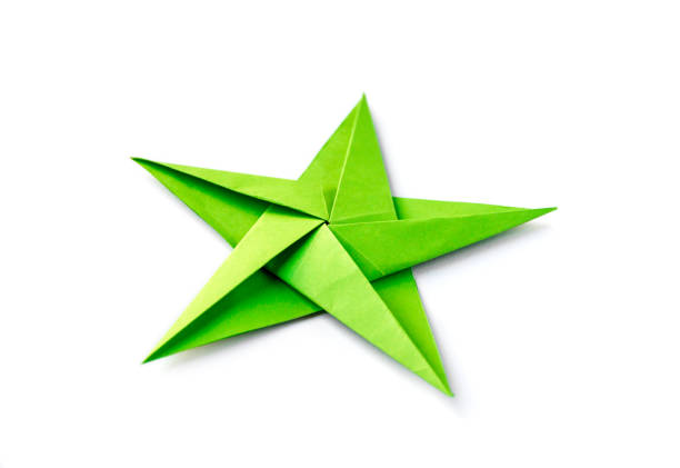 istock Green paper star origami isolated on a white background 1402595603