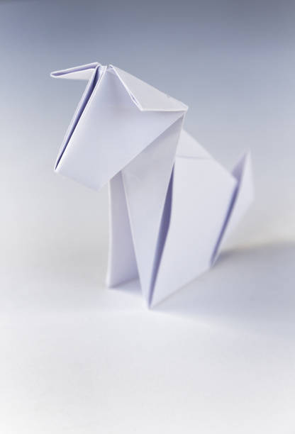 istock Paper dog origami isolated on a white background 1402595936