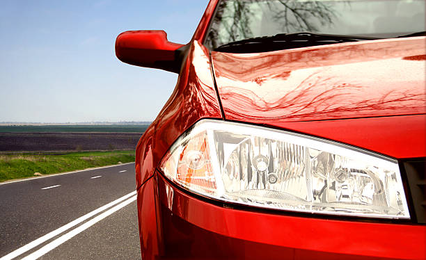 istock Red Sport car on a highway 140259654