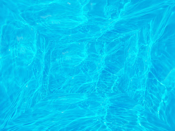 istock Defocus blurred transparent blue color room. Clear calm water surface texture with splashes and bubbles. Trendy abstract nature background. Water waves in sunlight. Bluewater room background. 1402598692
