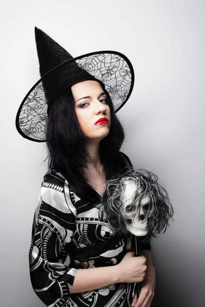 istock Young woman with a skull. 1402599061