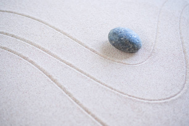 istock Zen Garden Japanese pattern on white sand background. 1402604859