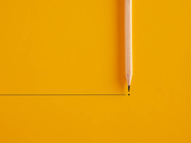 istock Pencil draws a line and a dot on yellow background. To end or finish something or retirement 1402606538