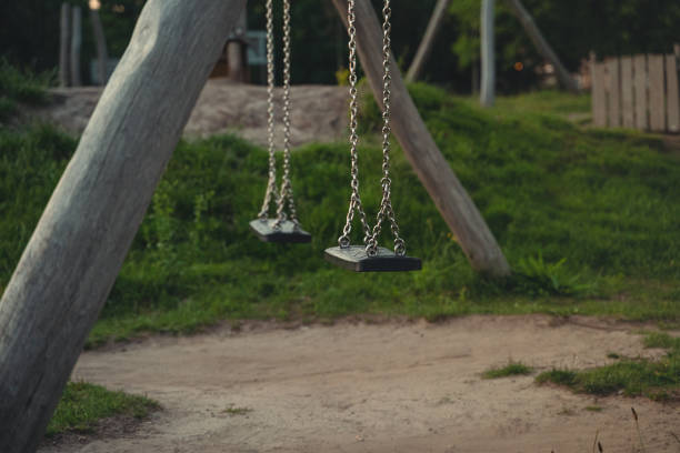 empty swing in the evening - swing playground empty abandoned imagens e fotografias de stock