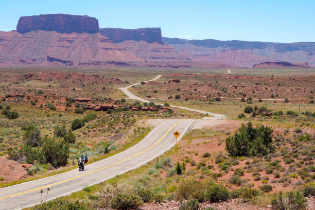 istock US road 128 winding through Utah desert between red cliffs on abeautiful day of spring. Scenic drive through American southwest. Riding a remote road. 1402607179