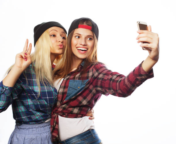 istock Pretty hipster girls taking selfie. 1402608592