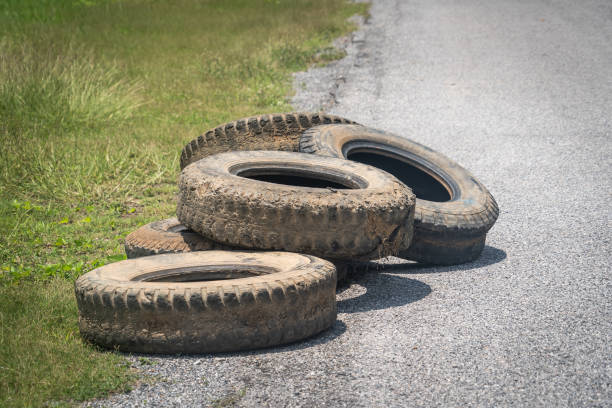 istock Old used tire stacked on street. 1402609402