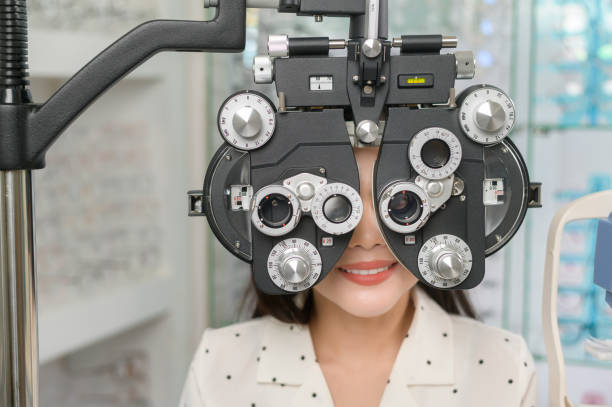 istock Young female customer being examined visual test using Bifocal Optometry eyesight measurement device by ophthalmologist in optical center, eyecare concept. 1402611293