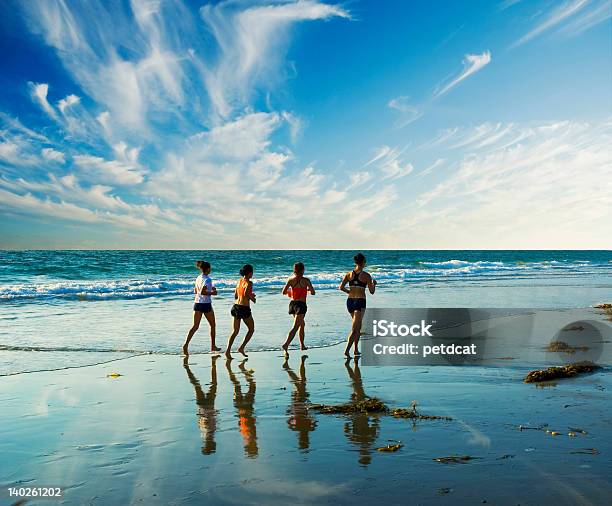 Jogging Along The Surf Stock Photo - Download Image Now - Active Lifestyle, Activity, Adult