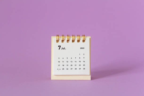 istock Desktop calendar for July 2022 on a lilac background., 1402614220