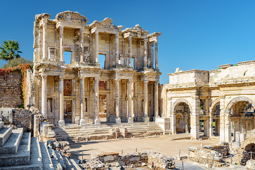Awesome view of the Gate of Augustus and the Library of Celsus in Ephesus (Efes). Ruins of the ancient Greek city in Selcuk, Izmir Province, Turkey. Ephesus is a popular tourist attraction in Turkey.