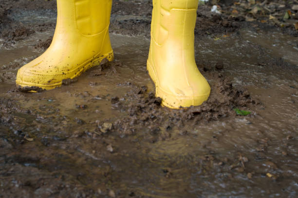 istock Farmer Boots in the soil 1402614433
