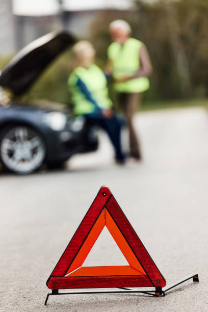 istock Portable warning triangle on the street. 1402614456