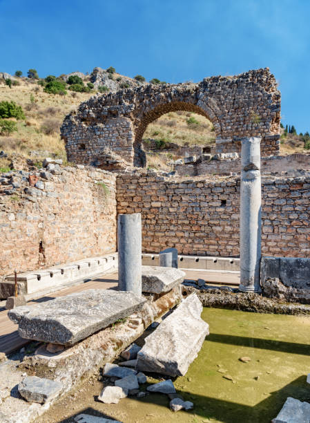 scenic ruins of the latrines of ephesus (efes) at turkey - toilet public restroom ephesus history imagens e fotografias de stock