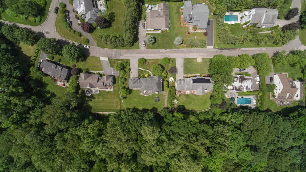 istock Suburb community on a sunny summer day. Aerial view. 1402616127