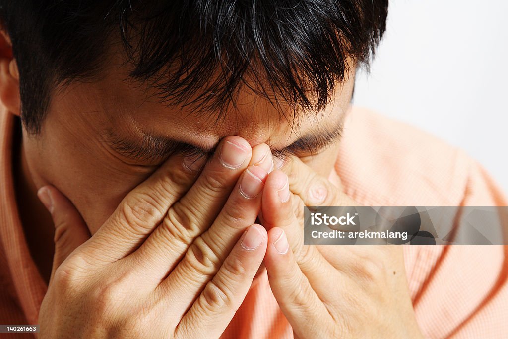 Stress Stressed out businessman having a headache Adult Stock Photo