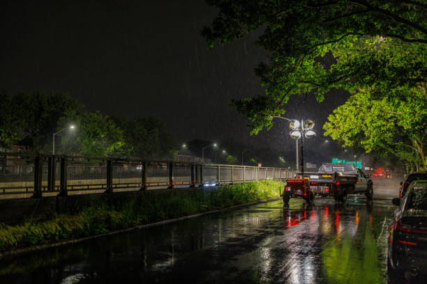 Roadworks in the night under the rain on the Grand Central Parkway, Queens, New York.