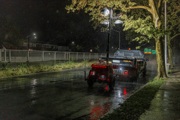 Roadworks in the night under the rain on the Grand Central Parkway, Queens, New York.