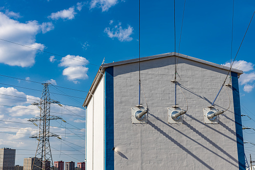 the building of the electrical substation to which the wires go. High quality photo