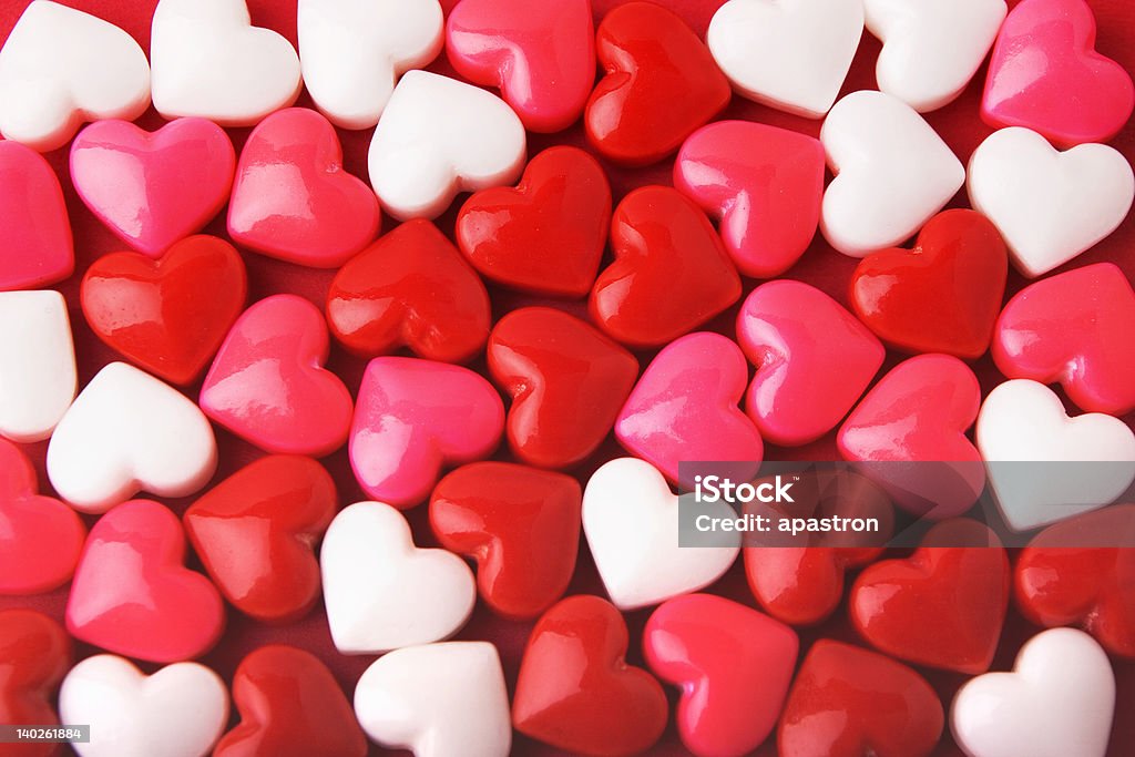 Red, white, and pink candy hearts background Candy Valentine hearts background Candy Heart Stock Photo