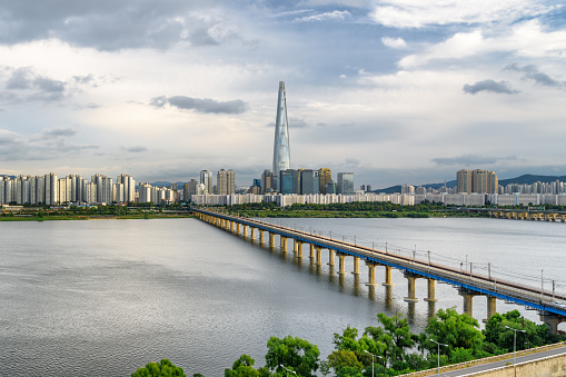 Awesome view of skyscraper and Jamsil Railway Bridge over the Han River (Hangang) in Seoul, South Korea. Amazing cityscape. Seoul is a popular tourist destination of Asia.