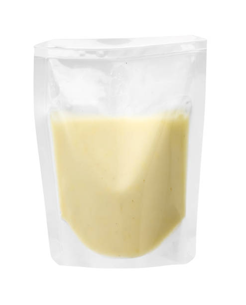 istock Cheese sauce in plastic bag isolated on white 1402621358
