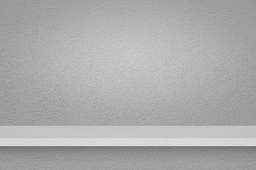 perspective of grey concrete shelf on dark gray concrete wall for interior and display show products, studio room